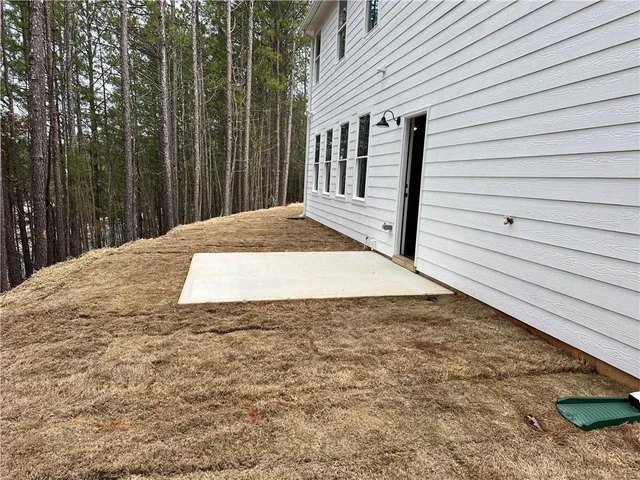 a view of a backyard of the house