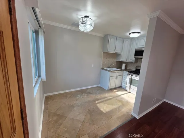 a view of a kitchen with microwave and stove