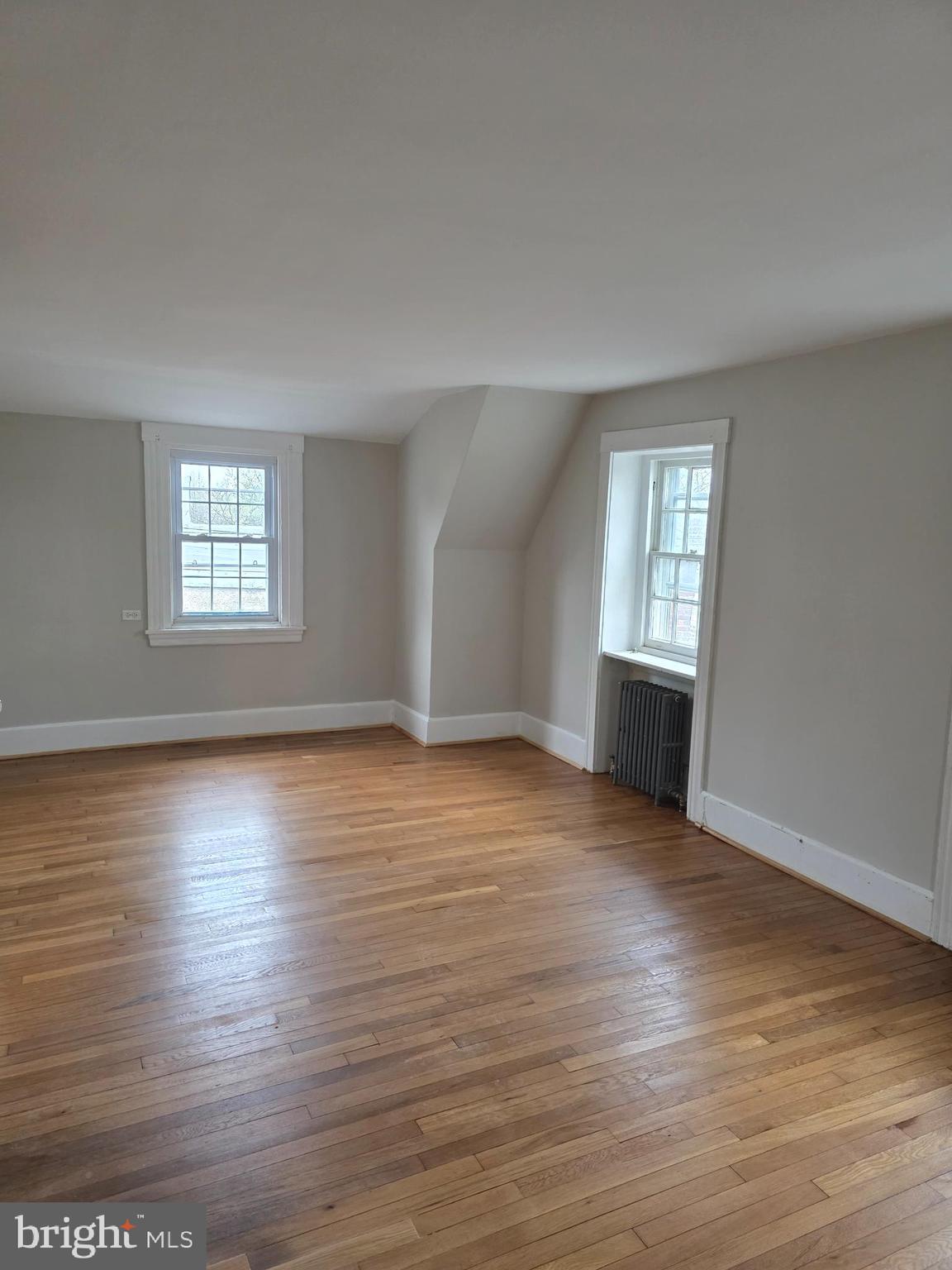 14 Avon Road Narberth, PA 19072 - Photo 13 of 17 an empty room with wooden floor and windows