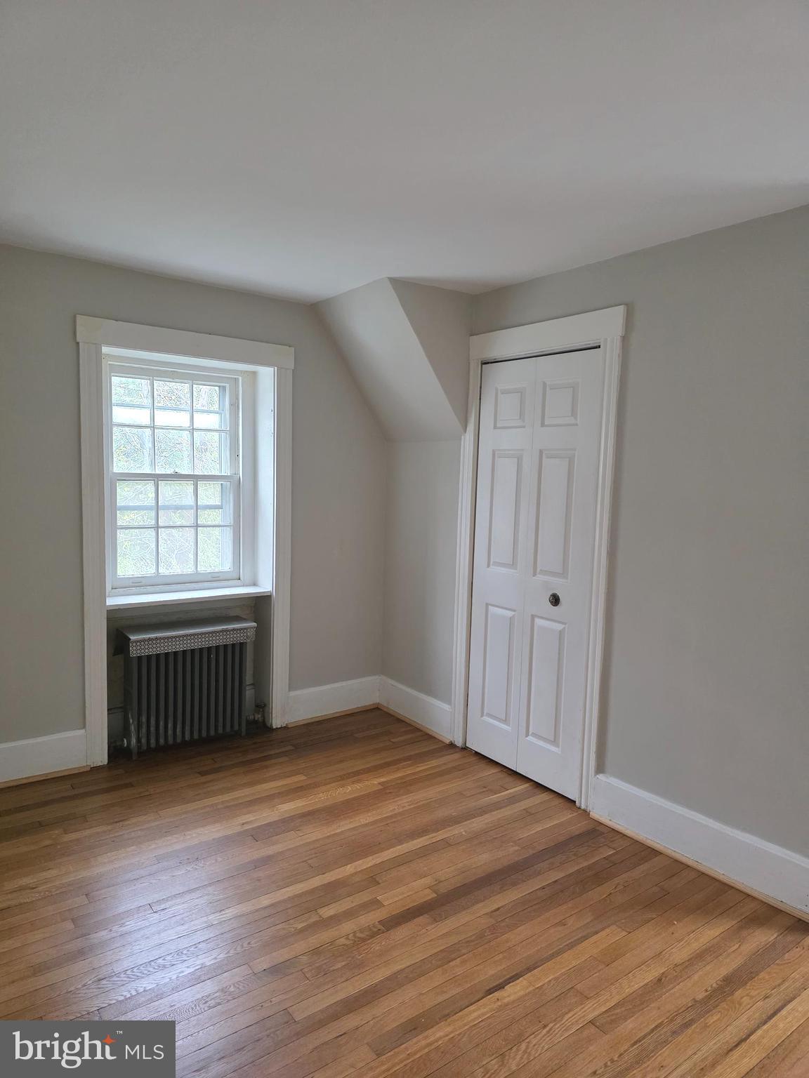 14 Avon Road Narberth, PA 19072 - Photo 14 of 17 wooden floor in an empty room with a window