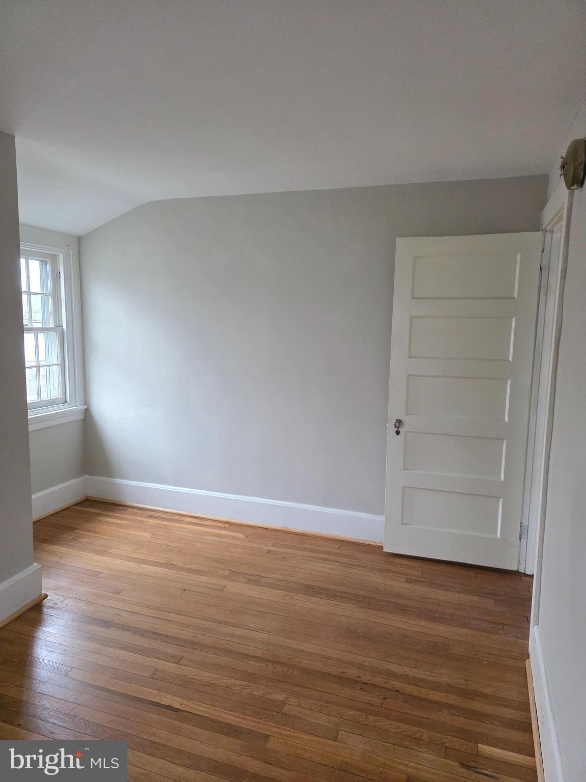14 Avon Road Narberth, PA 19072 - Photo 15 of 17 wooden floor in an empty room with a window