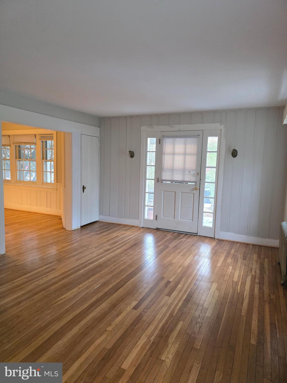 14 Avon Road Narberth, PA 19072 - Photo 4 of 17 a view of an empty room with wooden floor and a window