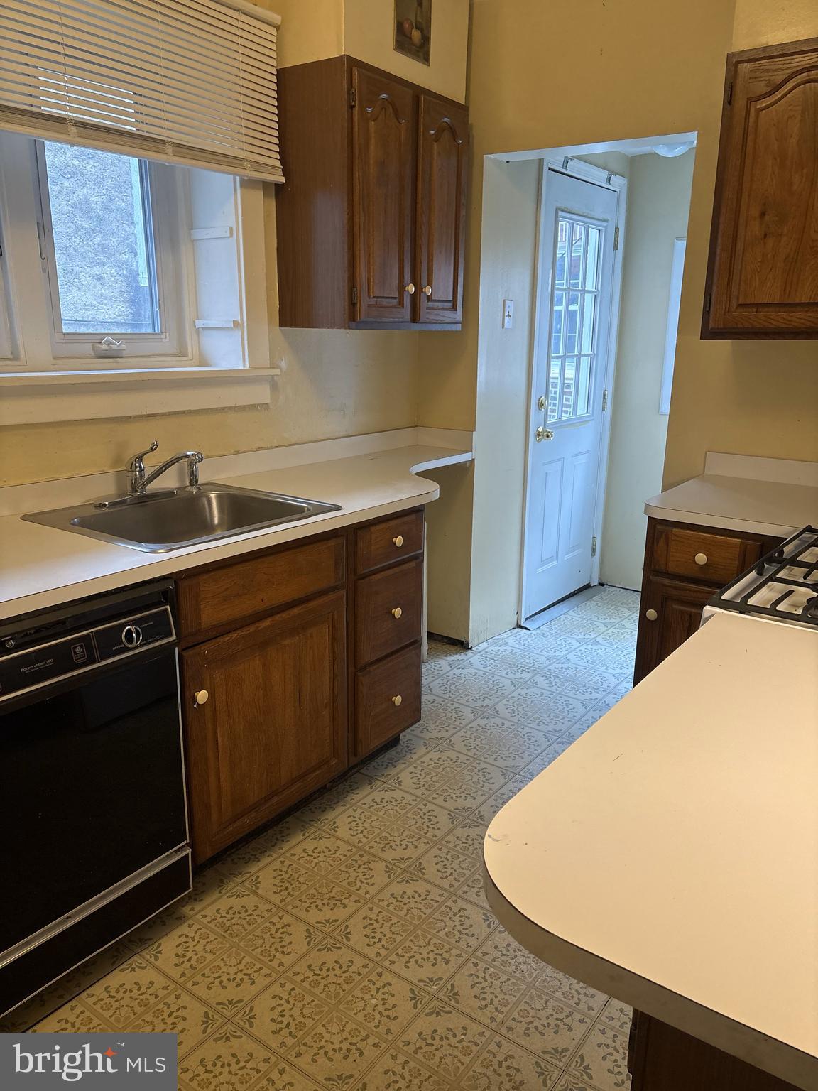 14 Avon Road Narberth, PA 19072 - Photo 9 of 17 a kitchen with a sink stove and cabinets