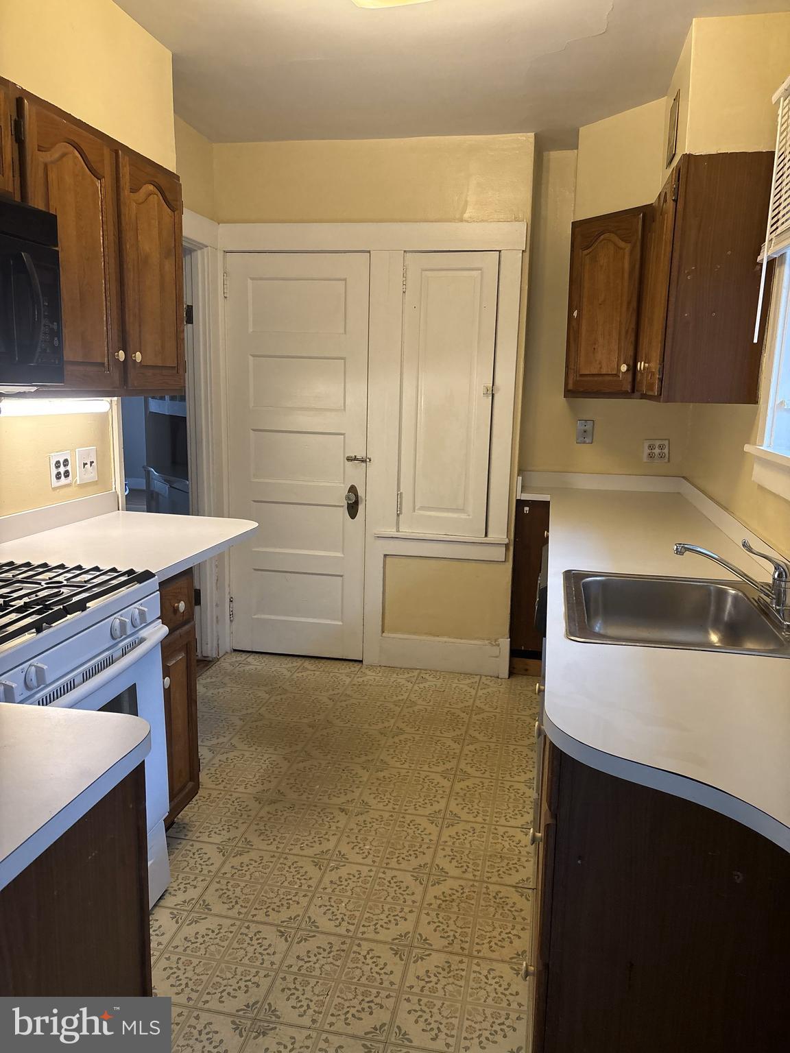 14 Avon Road Narberth, PA 19072 - Photo 10 of 17 a kitchen with a sink stove and refrigerator