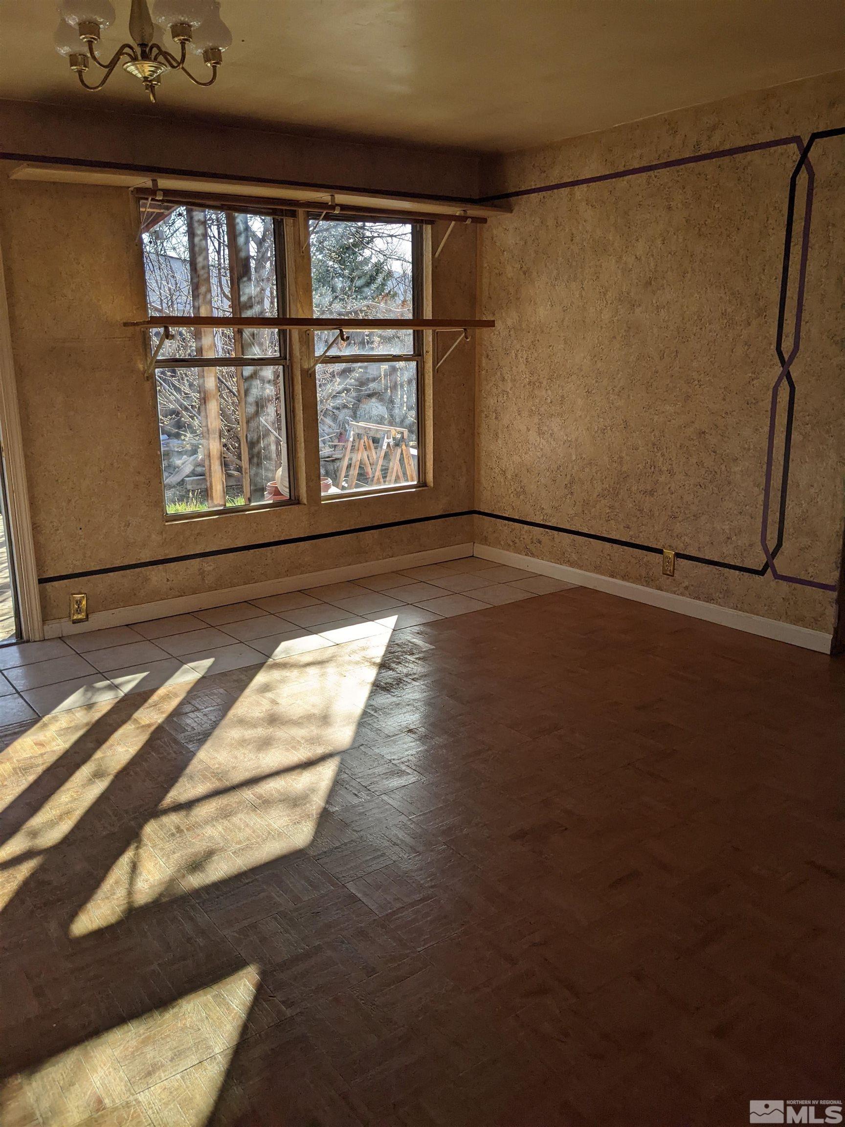 3960 Goldfinch Drive Reno, NV 89508 - Photo 7 of 15 a view of a livingroom with wooden floor and a window