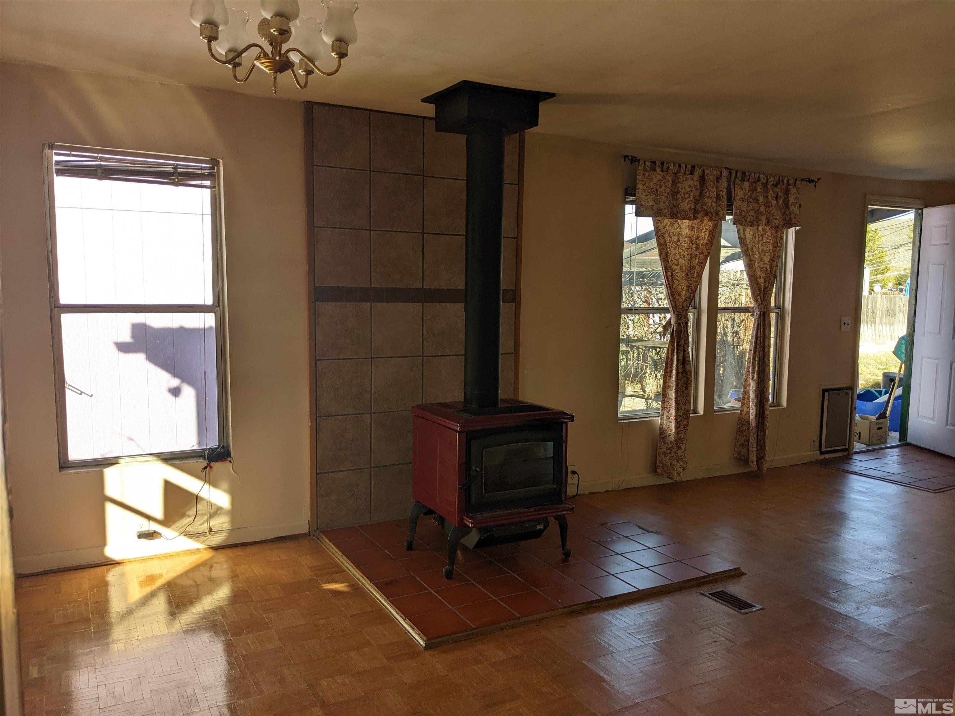 3960 Goldfinch Drive Reno, NV 89508 - Photo 8 of 15 a living room with furniture and a large window