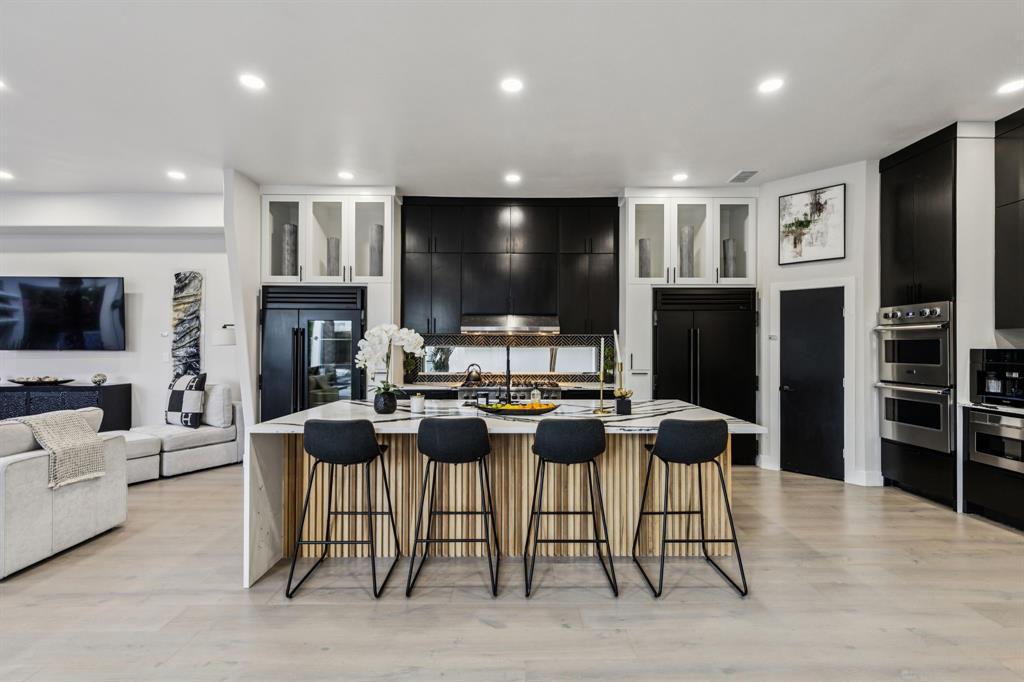 6 Savannah Ridge Frisco, TX 75034 - Photo 19 of 40 a living room with fireplace furniture and a flat screen tv