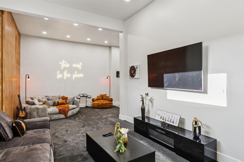 6 Savannah Ridge Frisco, TX 75034 - Photo 22 of 40 an outdoor living room with furniture and a flat screen tv