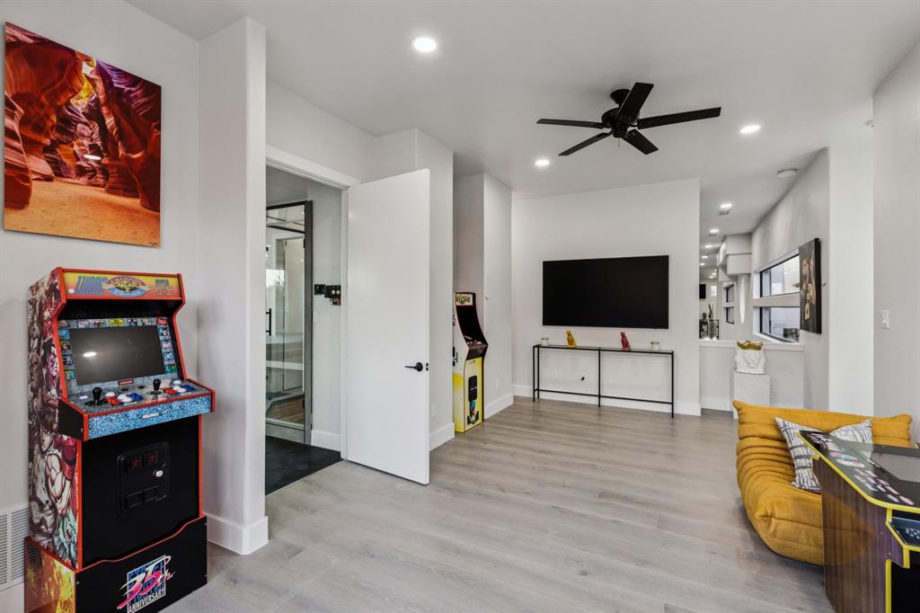 6 Savannah Ridge Frisco, TX 75034 - Photo 24 of 40 a living room with furniture and a flat screen tv