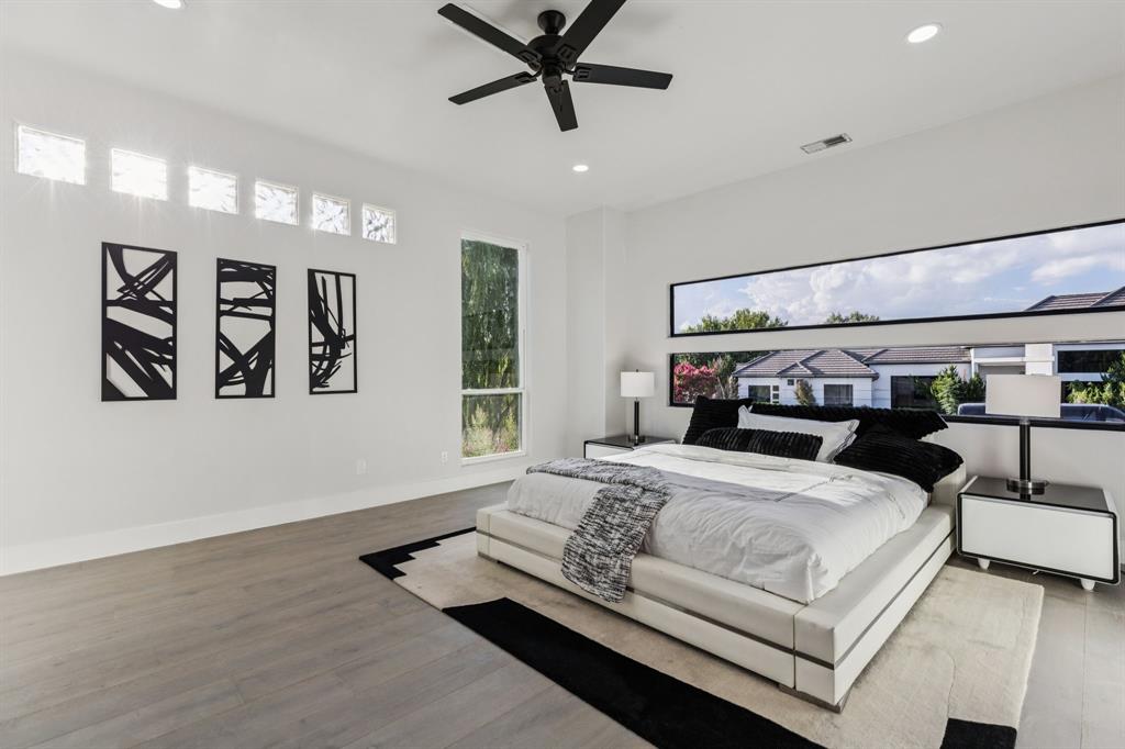 6 Savannah Ridge Frisco, TX 75034 - Photo 28 of 40 a bedroom with a large bed and a window