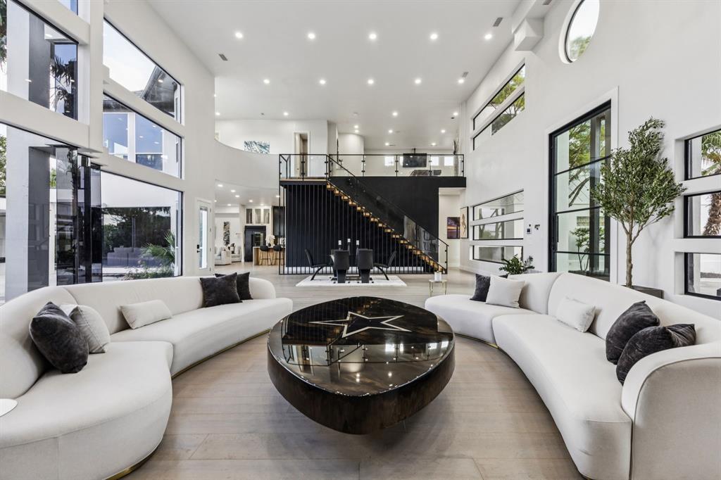 6 Savannah Ridge Frisco, TX 75034 - Photo 7 of 40 a living room with furniture and a fireplace