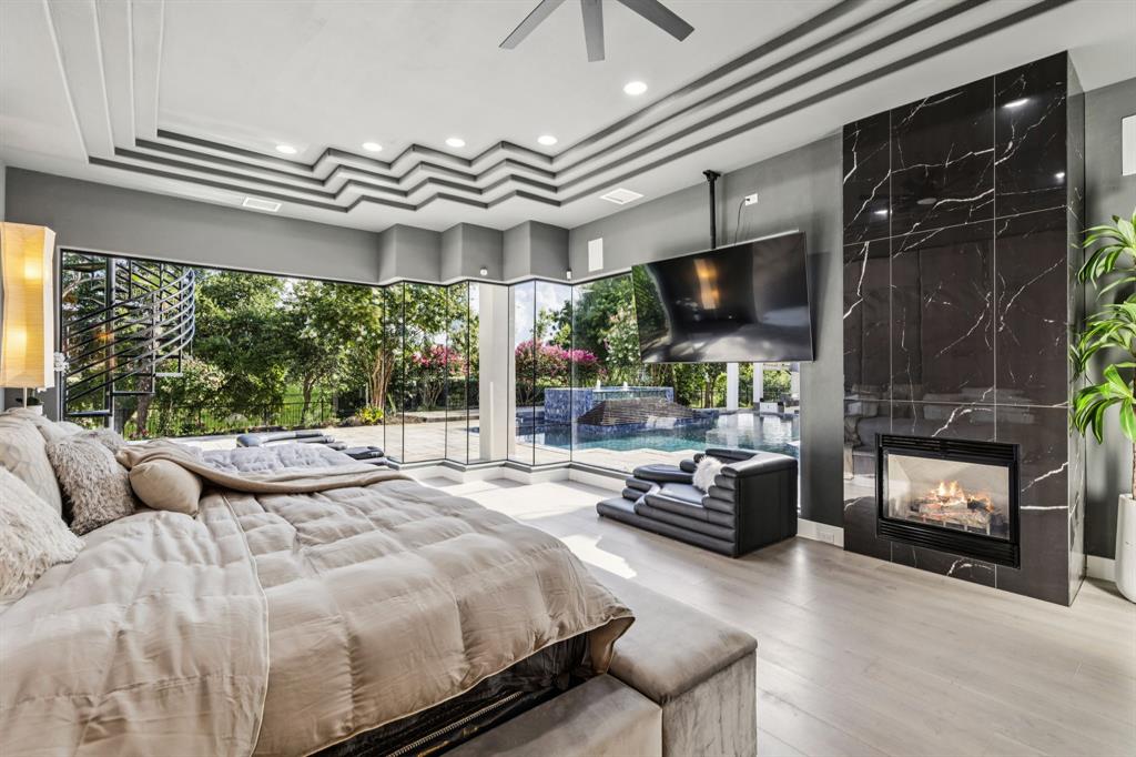 6 Savannah Ridge Frisco, TX 75034 - Photo 10 of 40 a bedroom with furniture and a large window