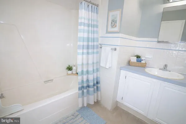 a bathroom with a bathtub sink and toilet