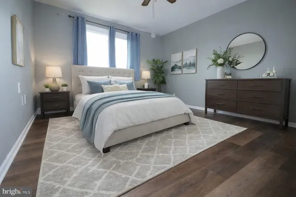 a bedroom with a bed and a dresser