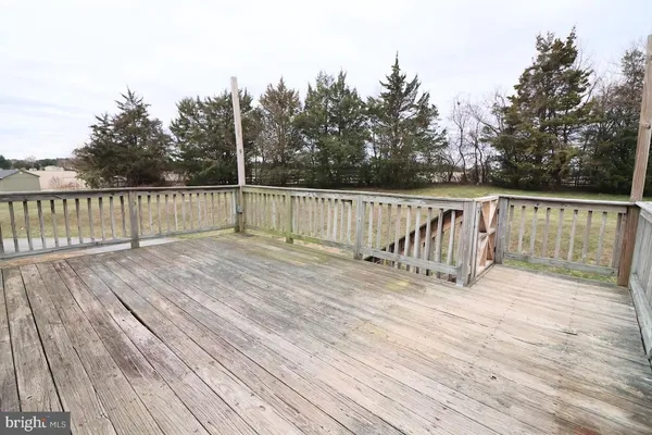 a terrace view with seating space barbeque oven and potted plants