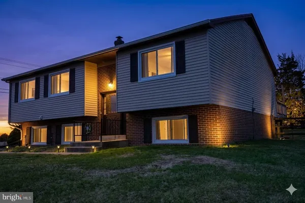 a front view of a house with a yard