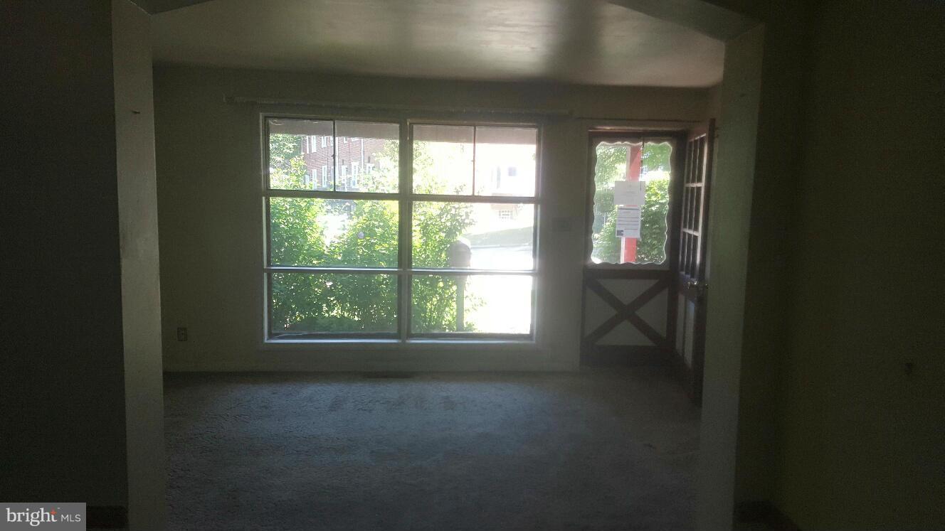 6224 Falkirk Road Baltimore, MD 21239 - Photo 4 of 11 a view of an empty room with a window