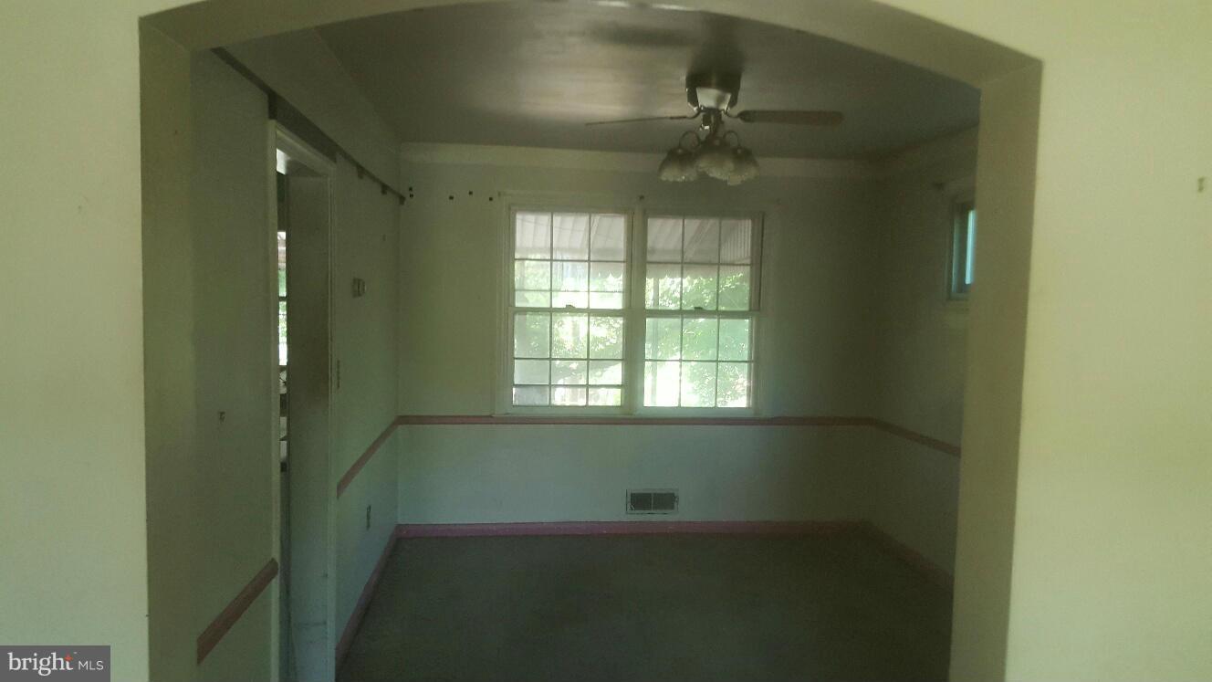 6224 Falkirk Road Baltimore, MD 21239 - Photo 5 of 11 a view of an empty room with a window