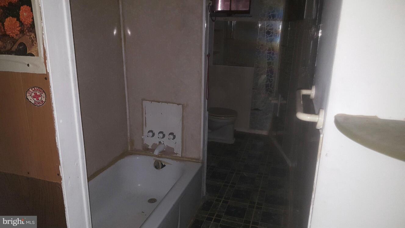 6224 Falkirk Road Baltimore, MD 21239 - Photo 7 of 11 a bathroom with a bathtub