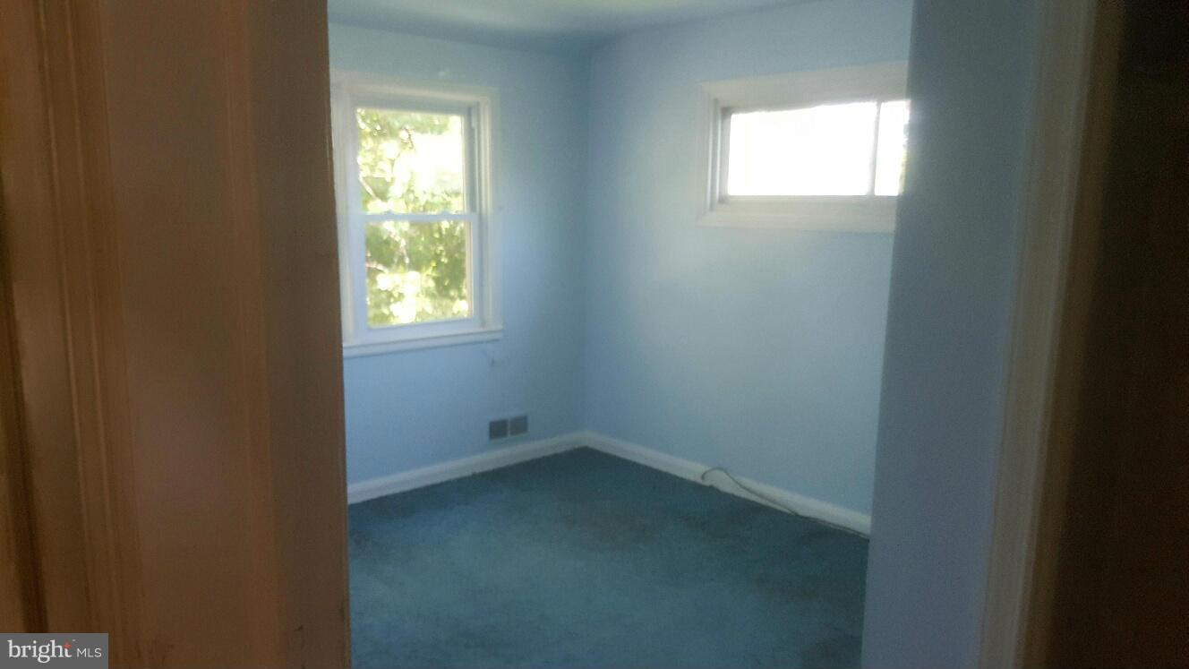 6224 Falkirk Road Baltimore, MD 21239 - Photo 9 of 11 an empty room with a window