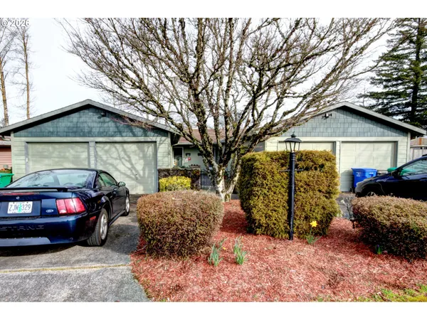 a view of a car in front of a house