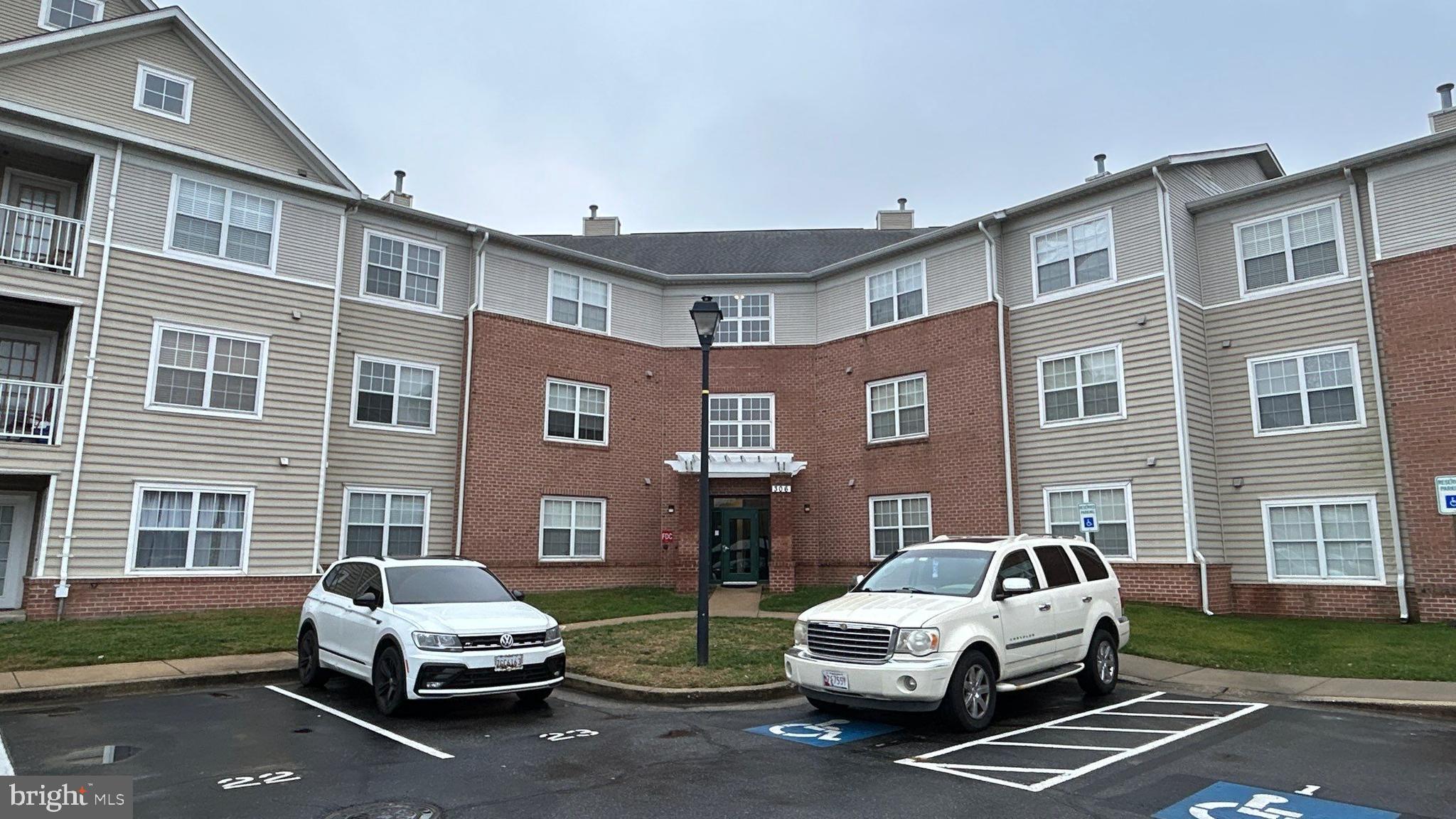 a car parked in front of a brick building