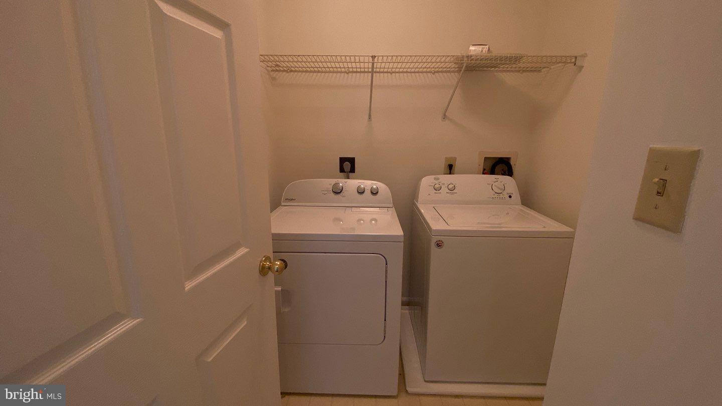 306 Gatehouse Lane, Unit E Odenton, MD 21113 - Photo 12 of 14 a utility room with dryer and washer