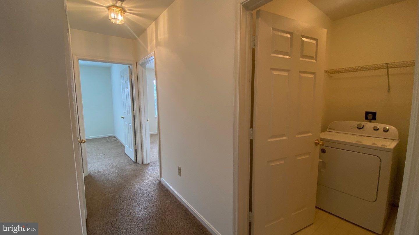 306 Gatehouse Lane, Unit E Odenton, MD 21113 - Photo 13 of 14 a view of a storage & utility room with a sink