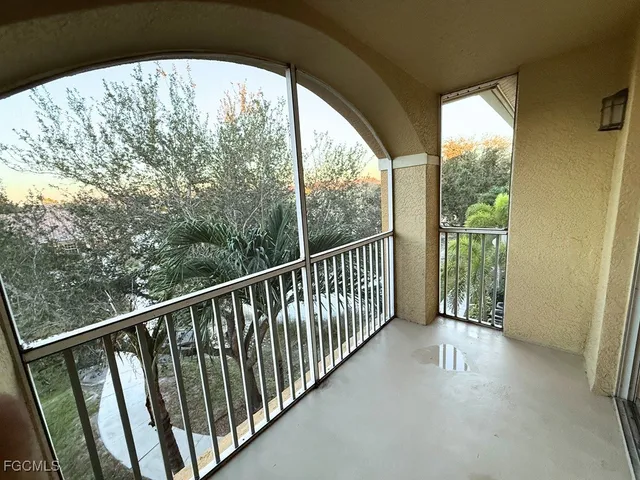 a view of a balcony with wooden floor