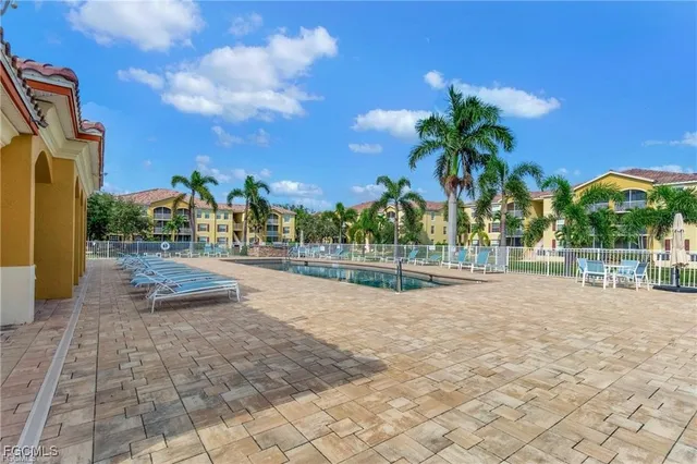 a view of a yard with palm trees