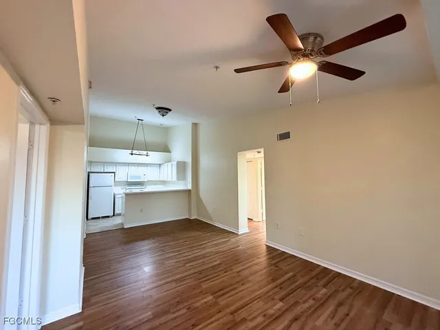 a view of kitchen with wooden floor