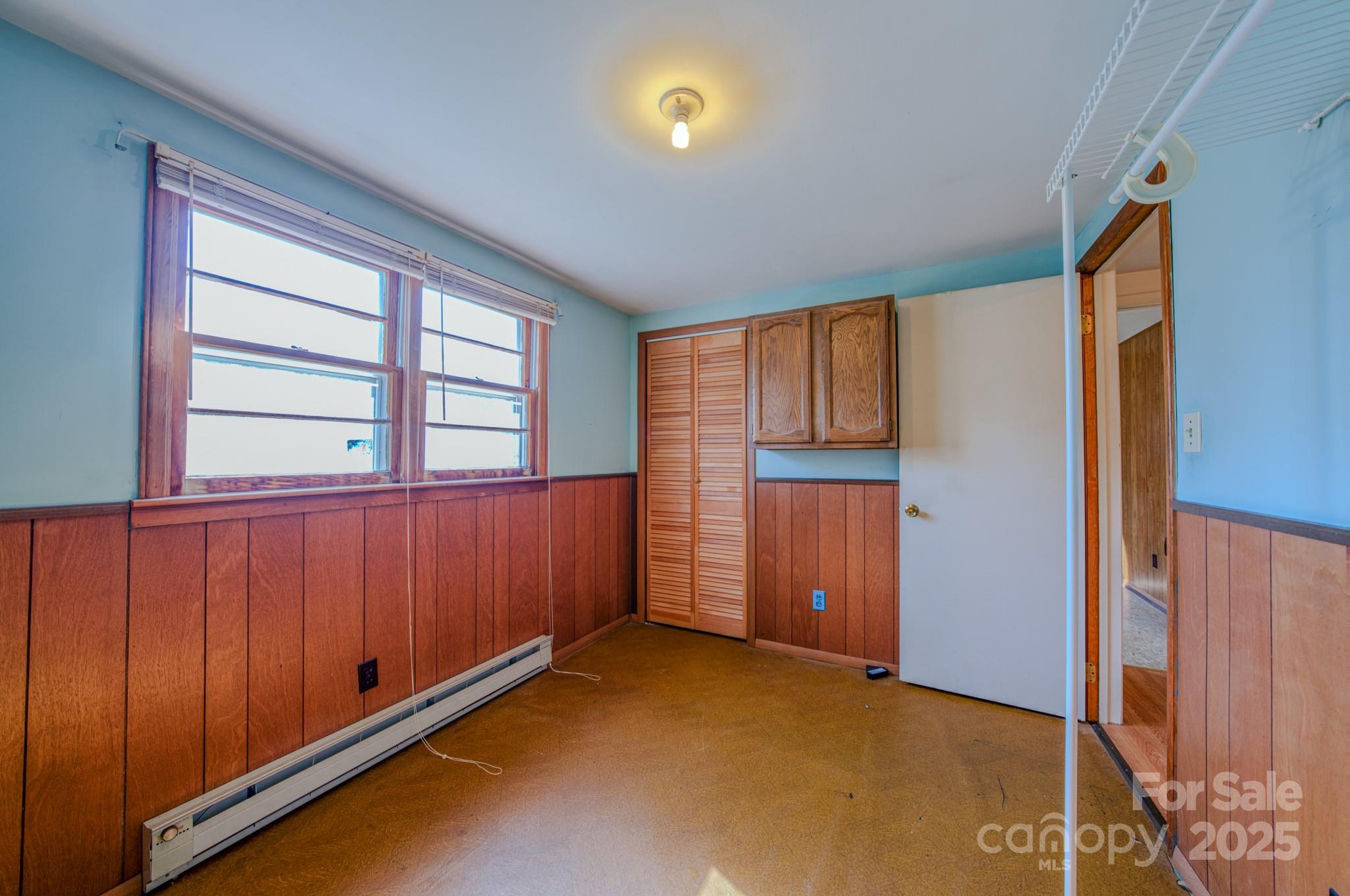 531 Bryson Road Candler, NC 28715 - Photo 21 of 45 a view of an empty room with a window