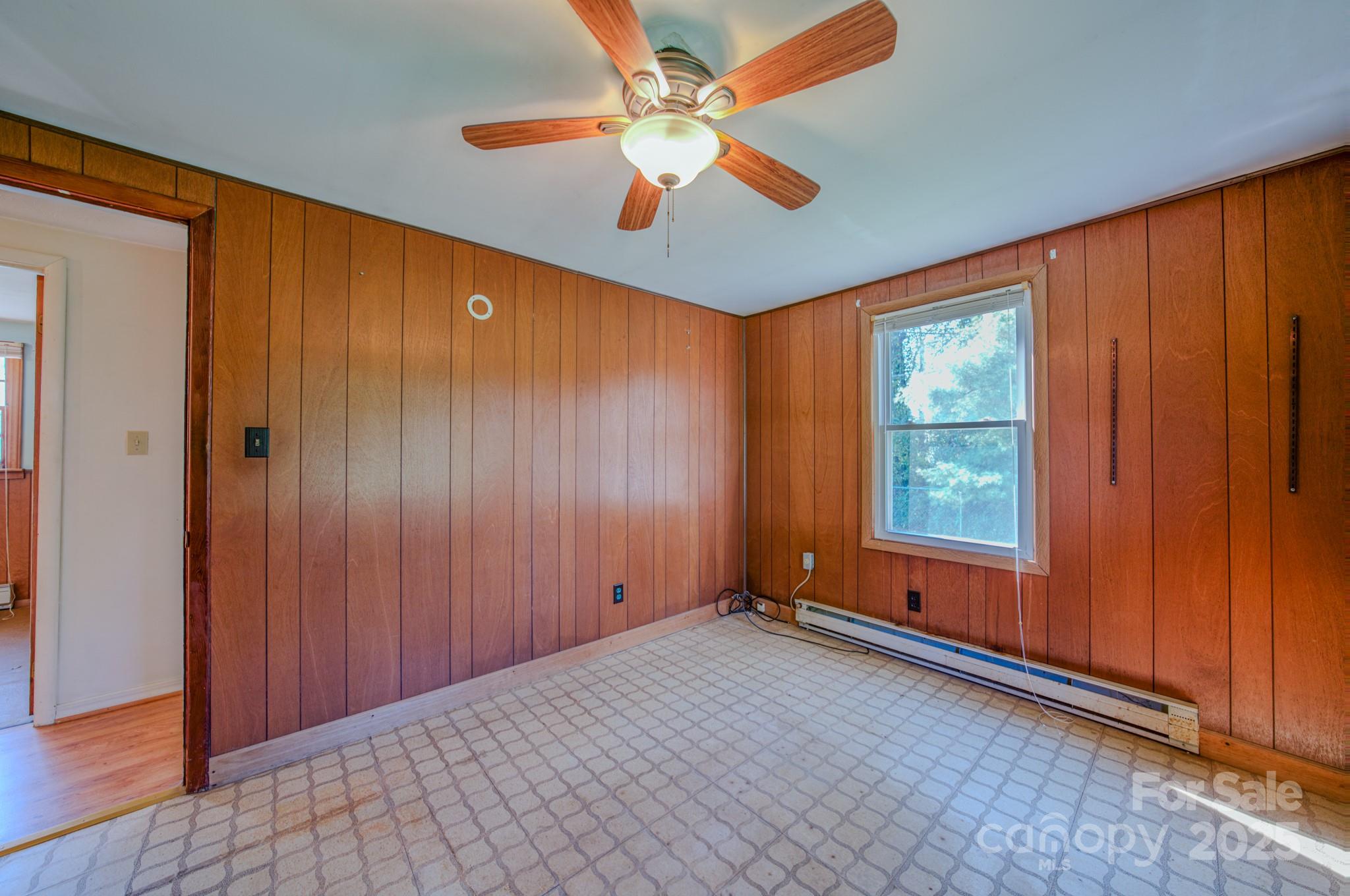 531 Bryson Road Candler, NC 28715 - Photo 23 of 45 an empty room with windows and fan