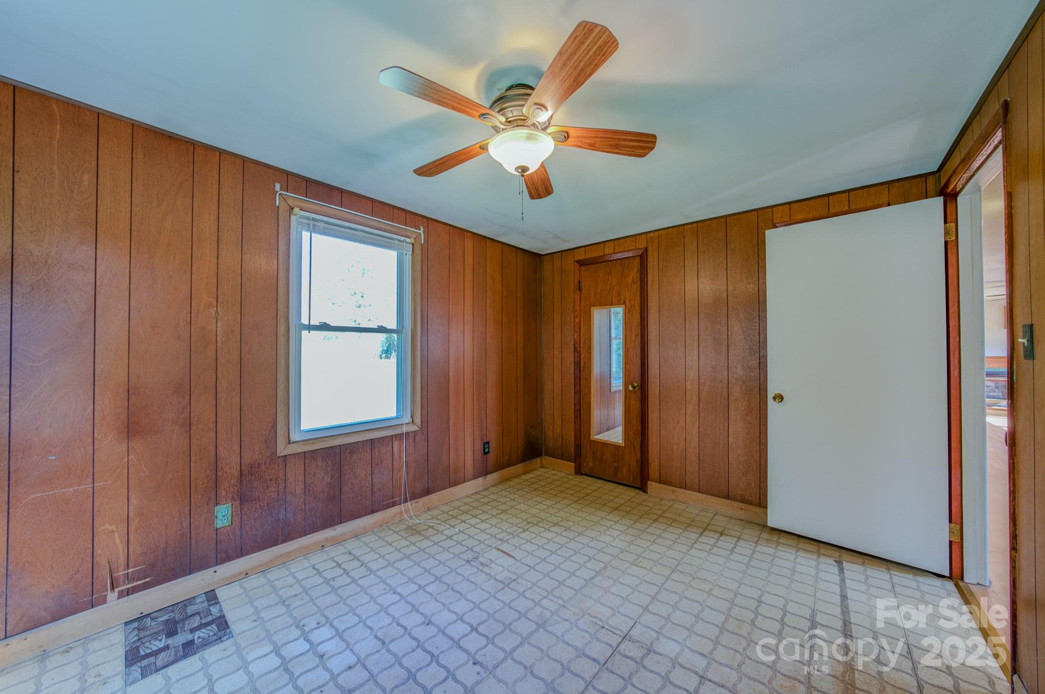 531 Bryson Road Candler, NC 28715 - Photo 25 of 45 wooden floor in an empty room with a window