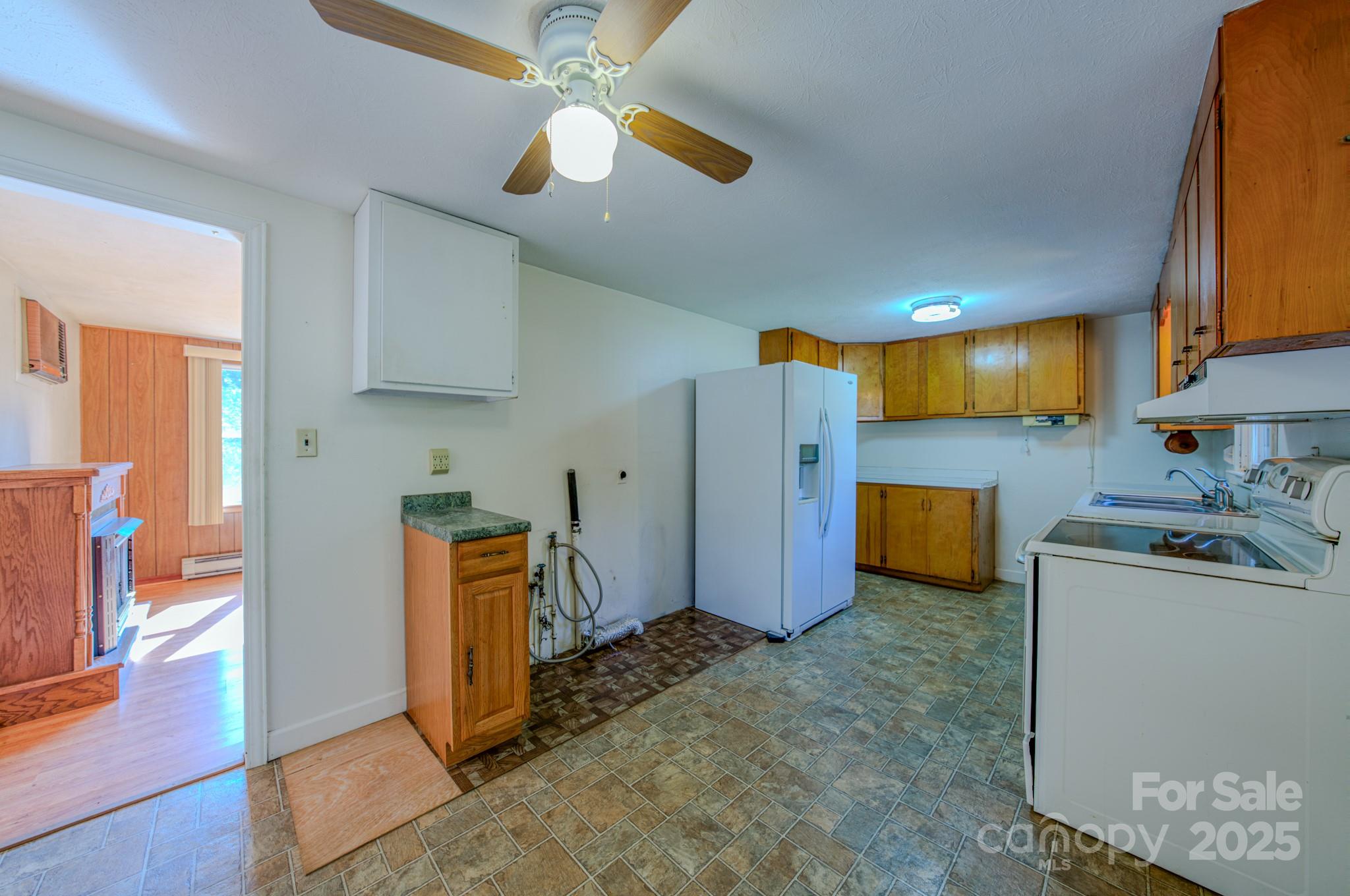 531 Bryson Road Candler, NC 28715 - Photo 29 of 45 a view of a kitchen with fridge and a sink