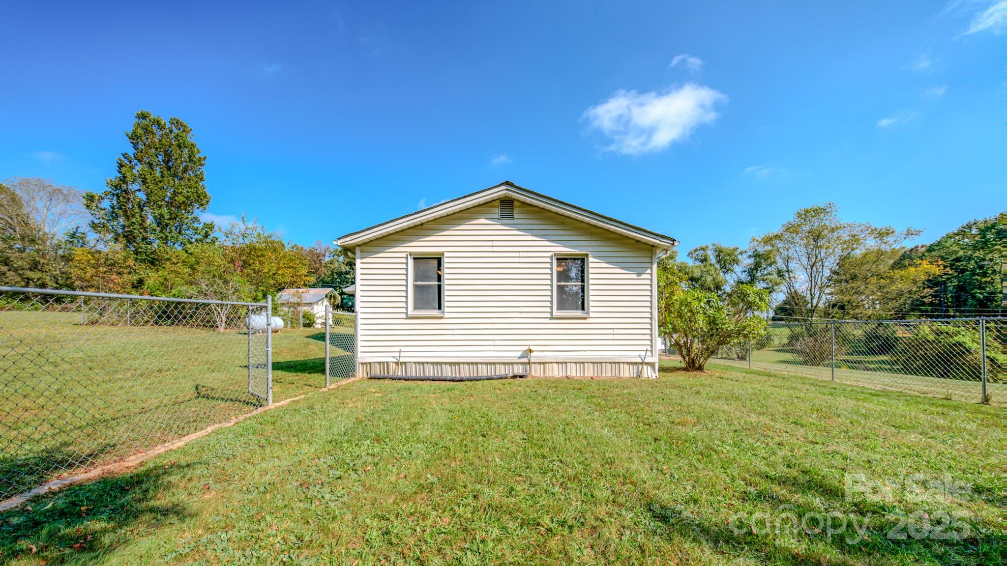 531 Bryson Road Candler, NC 28715 - Photo 32 of 45 a view of a house with a yard
