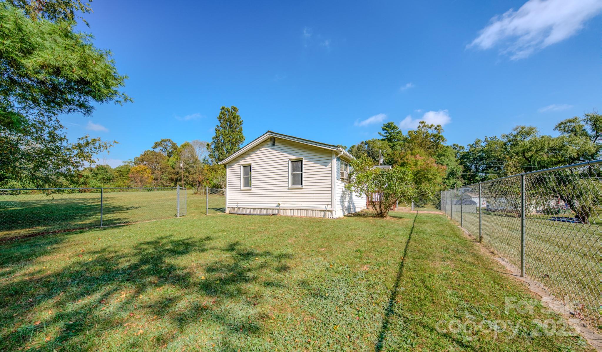 531 Bryson Road Candler, NC 28715 - Photo 33 of 45 a view of backyard of house with green space