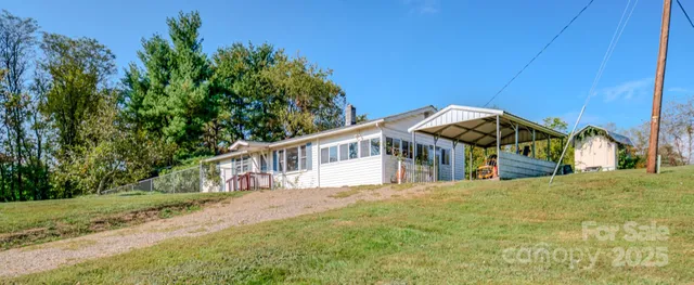 a view of a house with wooden fence