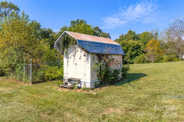 an aerial view of residential houses with yard