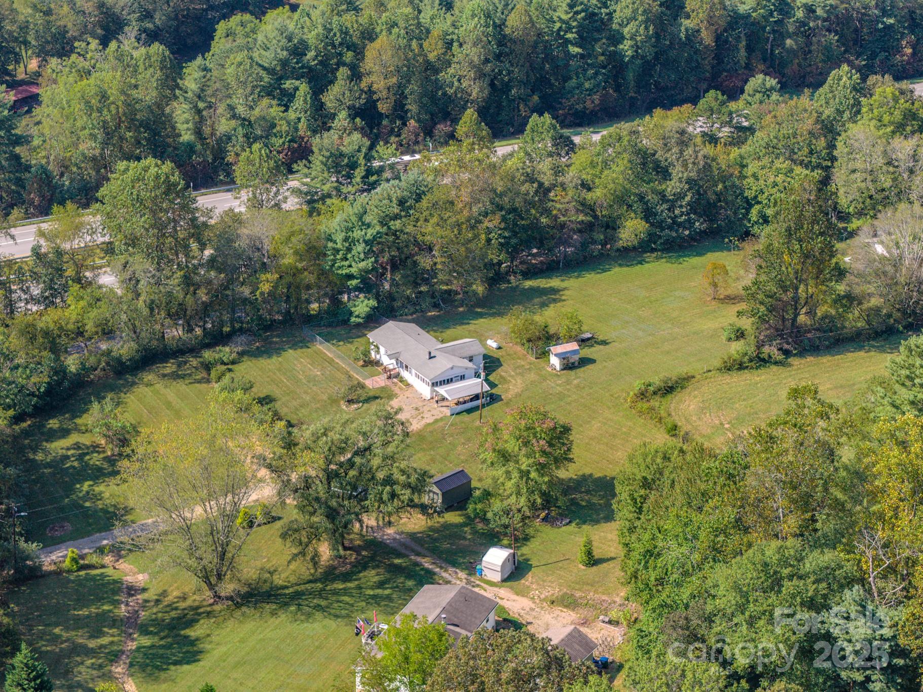 531 Bryson Road Candler, NC 28715 - Photo 40 of 45 an aerial view of residential houses with outdoor space