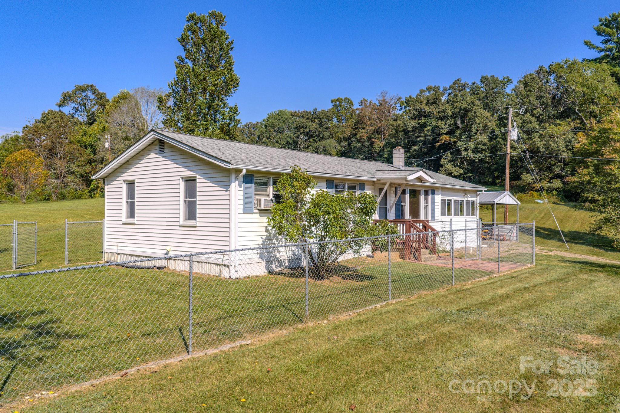 531 Bryson Road Candler, NC 28715 - Photo 4 of 45 a front view of a house with garden