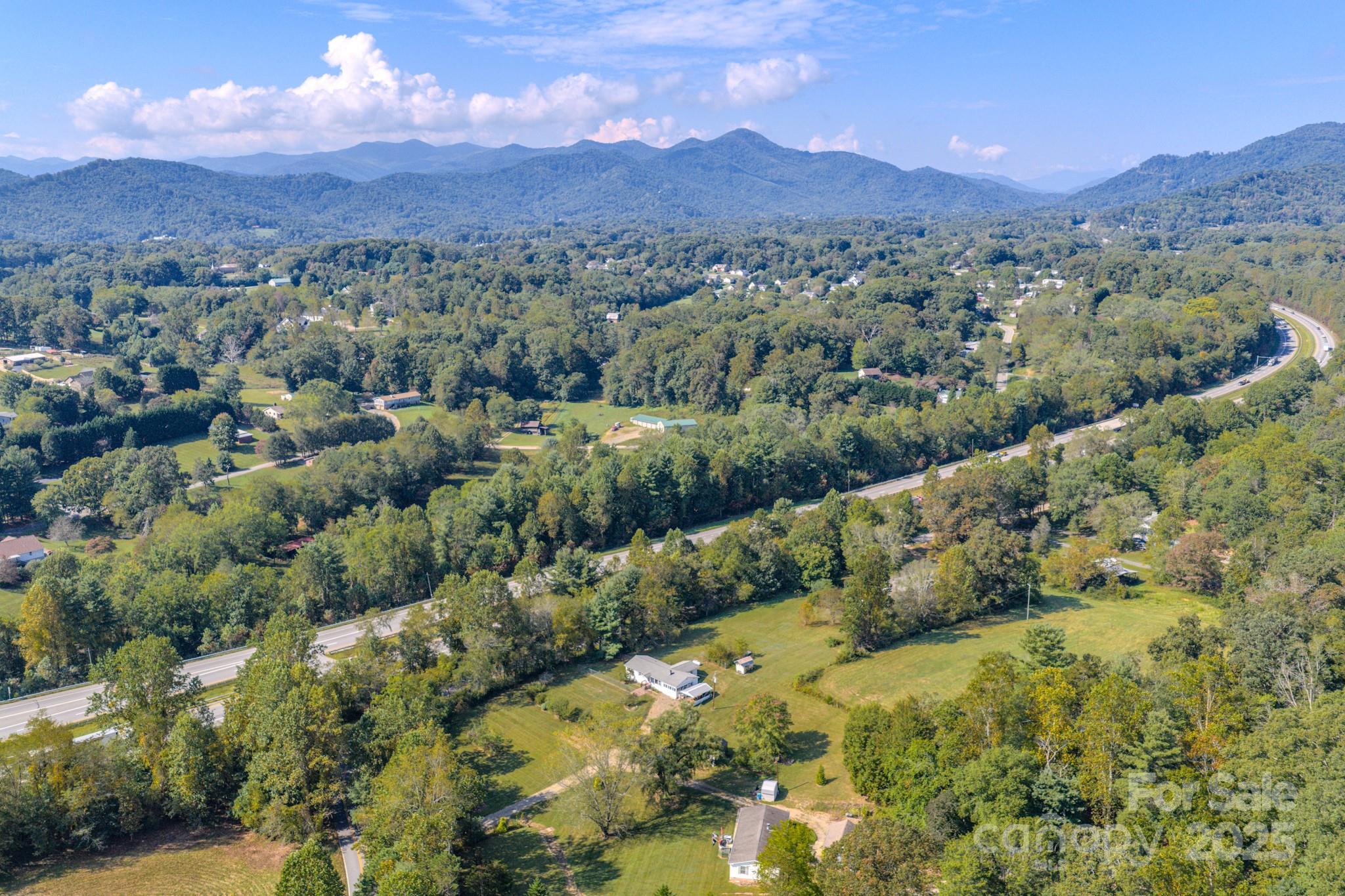 531 Bryson Road Candler, NC 28715 - Photo 41 of 45 an aerial view of a house with a yard