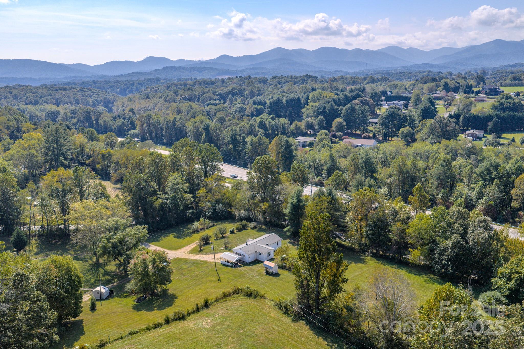 531 Bryson Road Candler, NC 28715 - Photo 42 of 45 an aerial view of residential house with an outdoor space and seating