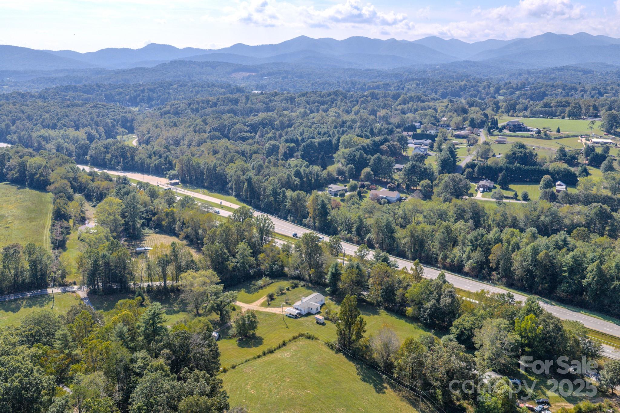 531 Bryson Road Candler, NC 28715 - Photo 43 of 45 an aerial view of a house with a garden