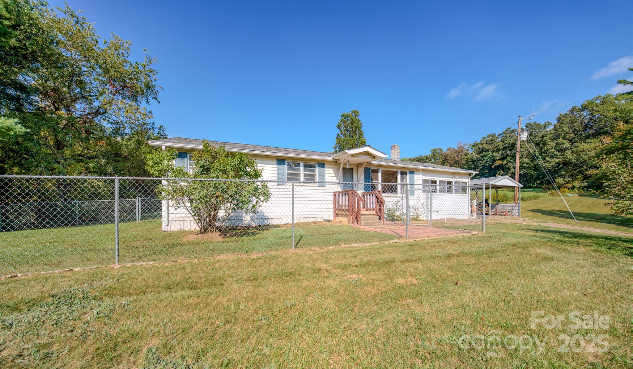 531 Bryson Road Candler, NC 28715 - Photo 7 of 45 a view of a house with backyard and trees