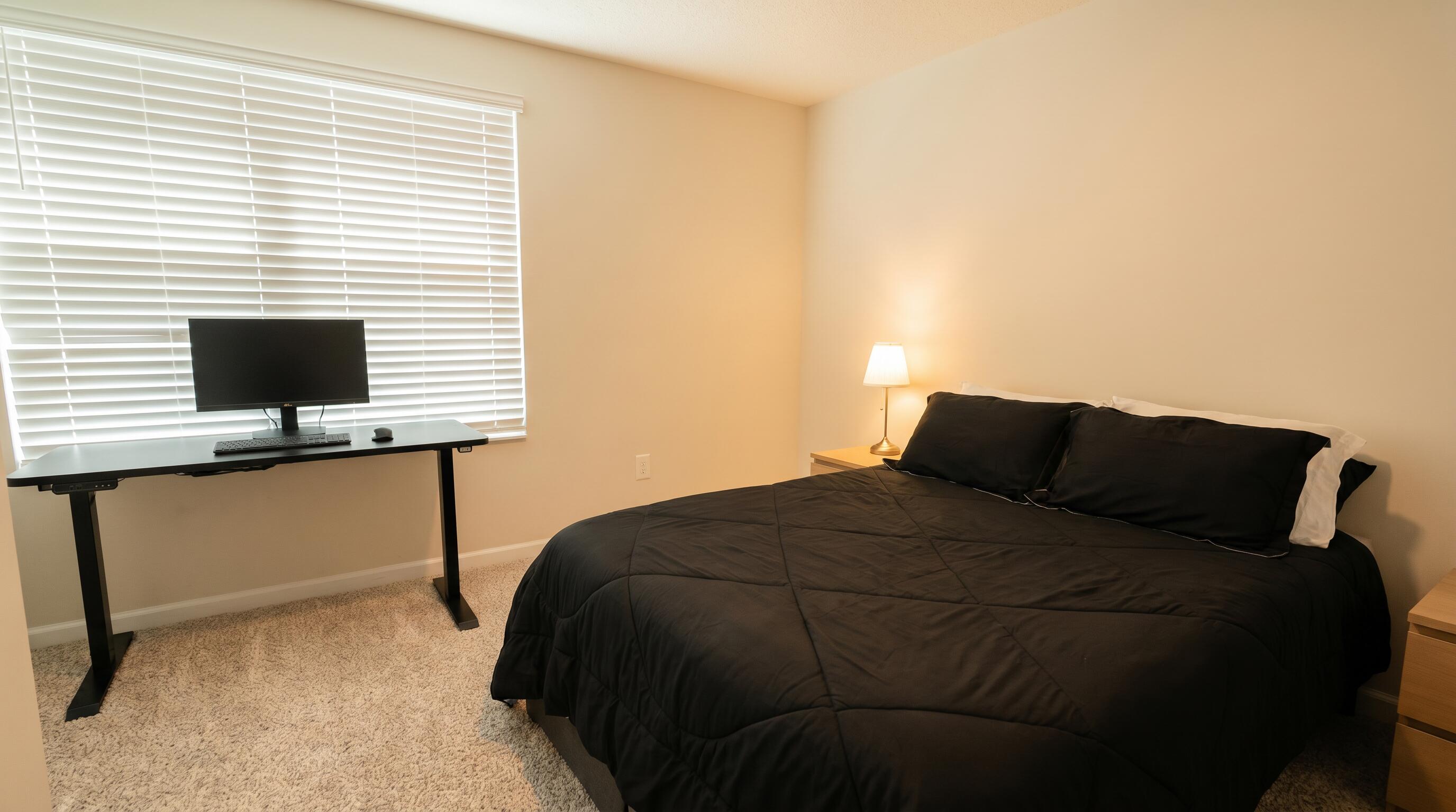 5784 Southeast Edgewater Circle Stuart, FL 34997 - Photo 12 of 33 a bedroom with a bed and two windows