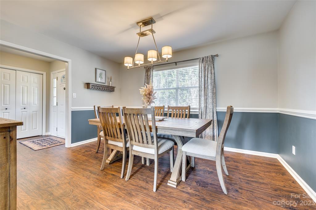 339 Gold Hill Road Fort Mill, SC 29715 - Photo 13 of 48 a view of a dining room with furniture window and wooden floor