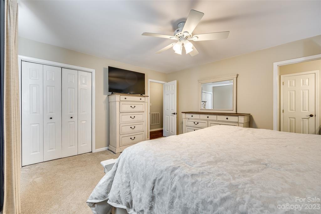 339 Gold Hill Road Fort Mill, SC 29715 - Photo 23 of 48 a bedroom with a bed and a flat screen tv
