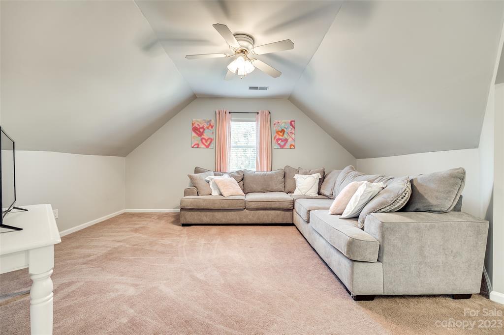 339 Gold Hill Road Fort Mill, SC 29715 - Photo 33 of 48 a living room with furniture chandelier and a large window
