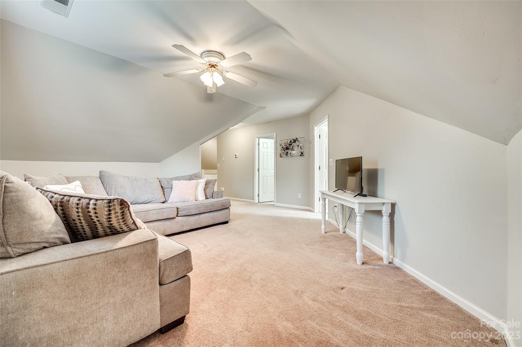 339 Gold Hill Road Fort Mill, SC 29715 - Photo 34 of 48 a living room with furniture and a flat screen tv